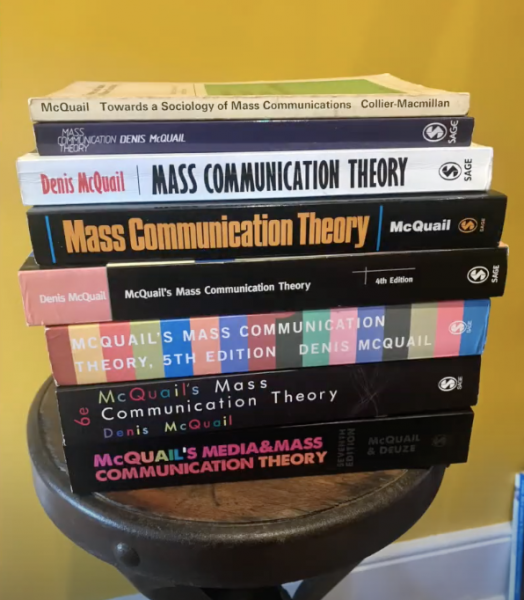stack of eight textbooks