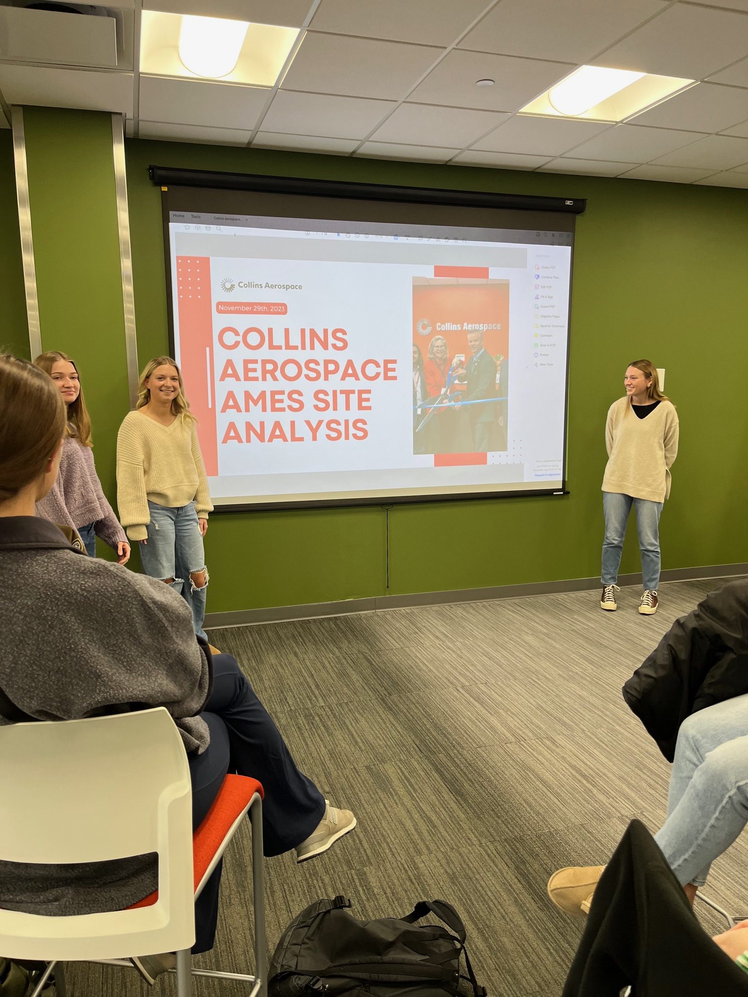 two students give a presentation in class