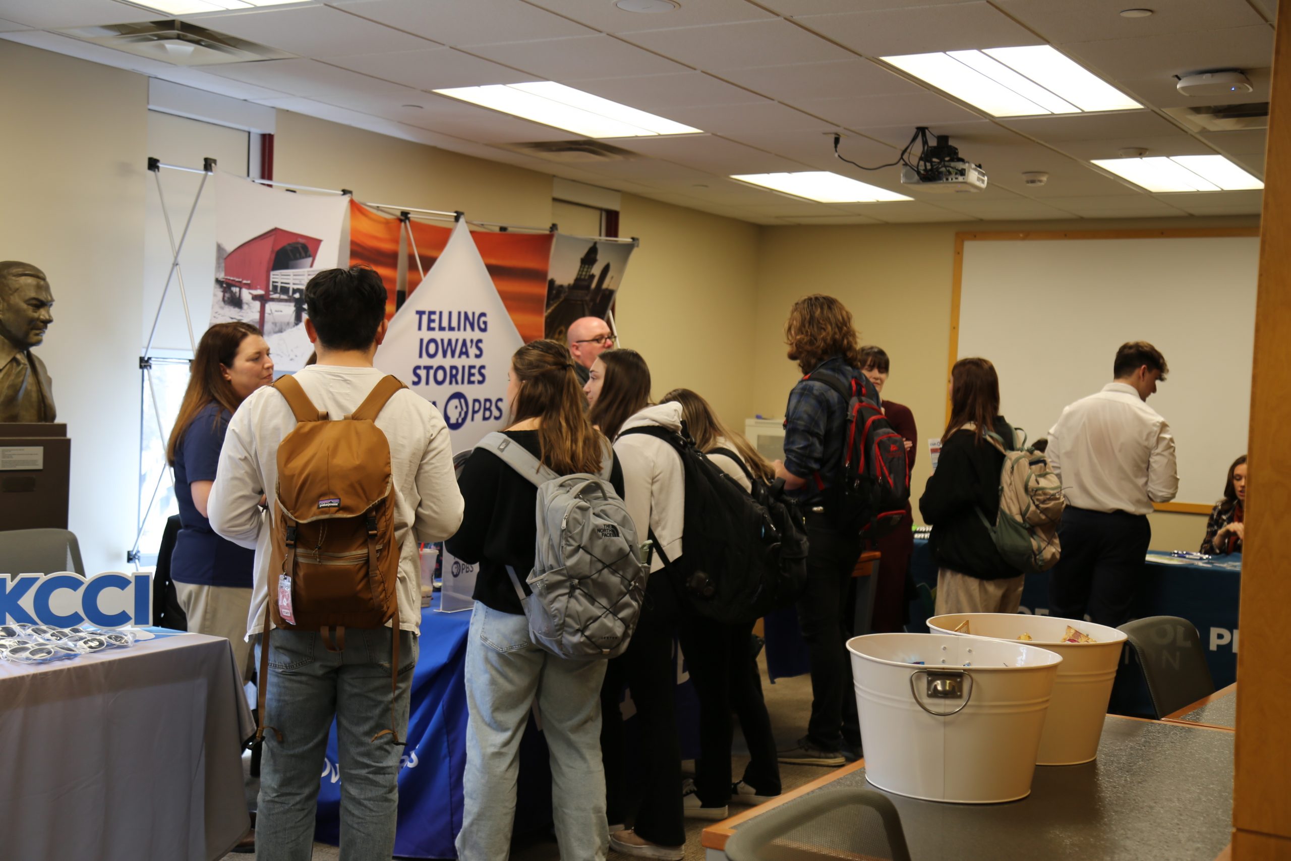 Group of students visiting the Iowa PBS booth