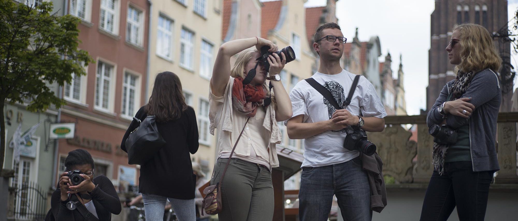 Students stop to take photos while studying abroad