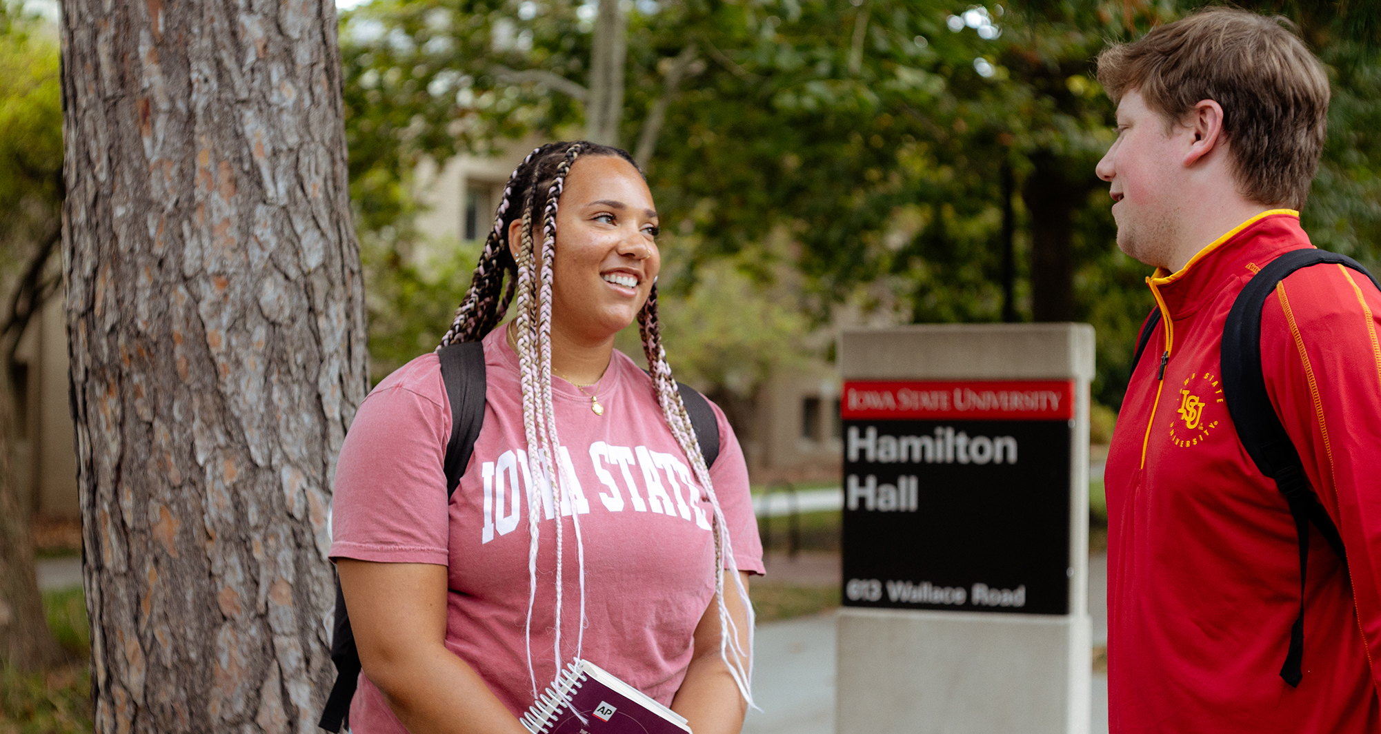 Two students standing outside Hamilton Hall