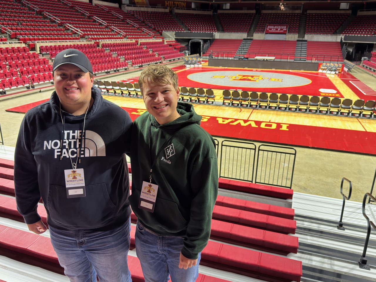 Two students in Hilton with court behind them